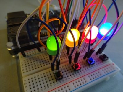 Photo of Simple Brian project showing four glowing coloured LEDs
