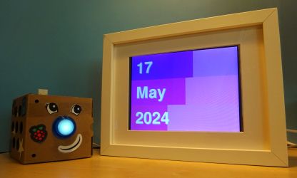 Photo showing the progress calendar on a screen mounted in a picture frame.